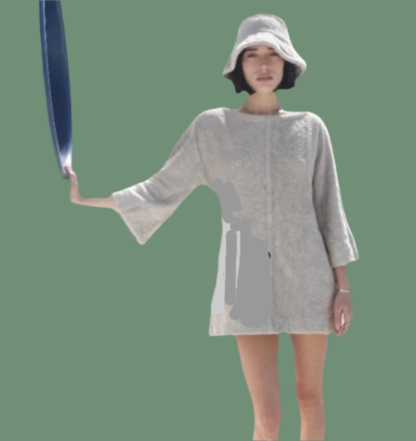 A person wearing a mid-thigh length olive green dress with bell sleeves, paired with a matching hat.